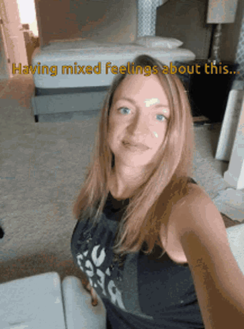 a woman taking a selfie with a caption that says " having mixed feelings about this "