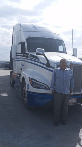 a man stands in front of a semi truck with a license plate that says jcl-259