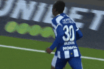 a soccer player wearing a blue and white uniform with the number 30 on it