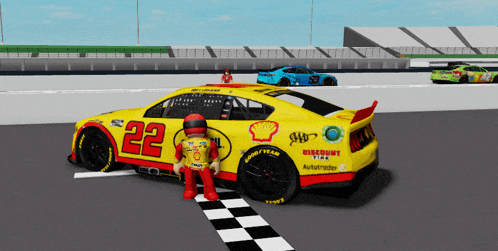 a yellow race car has the number 22 on the side