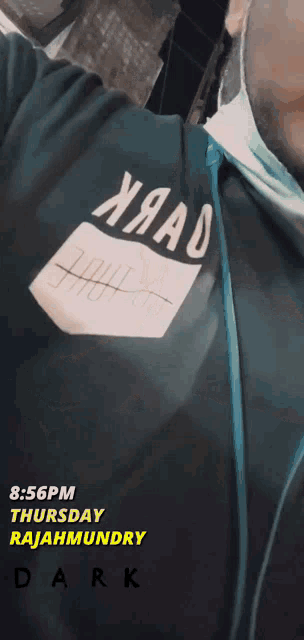 a man wearing a shirt that says ' xmad ' on it