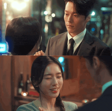 a man in a suit and tie looks at a woman in a braided ponytail