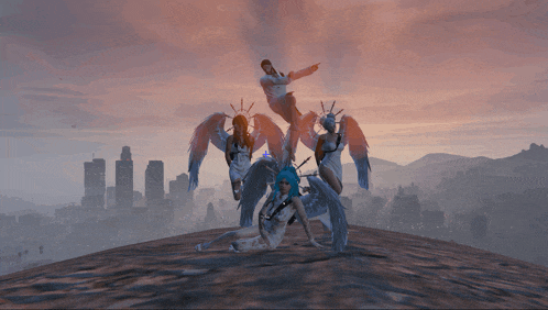 a group of angels posing for a picture on top of a hill