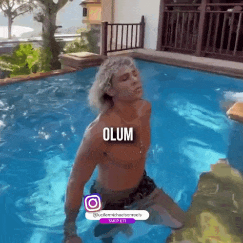 a shirtless man is kneeling in a swimming pool with the word olum written on the bottom