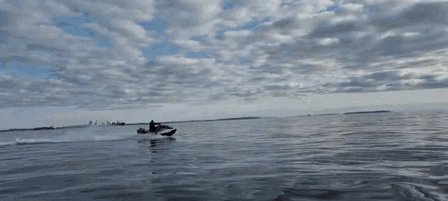 a person is riding a jet ski in the water