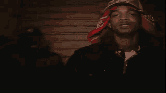 a man with a red bandana on his head