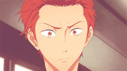 a close up of a red haired anime character 's face with a smirk on his face