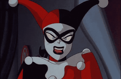 harley quinn from the batman the animated series is wearing a red and white jester hat and mask .