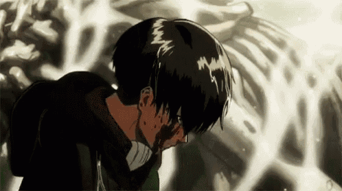 a man with blood coming out of his mouth is standing in front of a skeleton .
