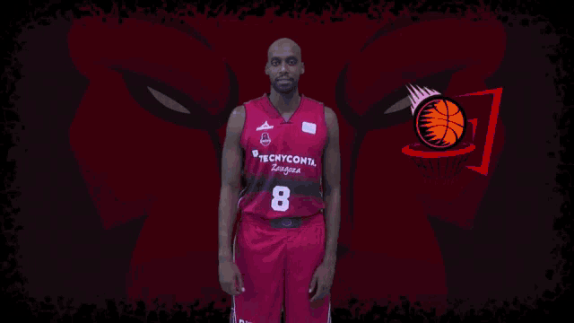 a basketball player named johnny berhanemeskel stands in front of a red background
