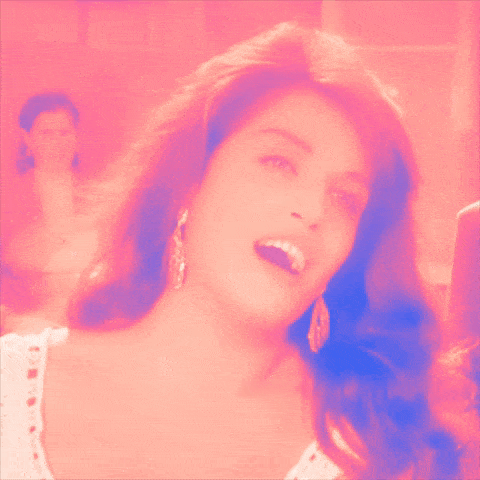 a close up of a woman 's face with pink and blue tones