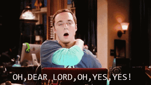 a man sitting in front of a laptop says oh dear lord oh yes yes !