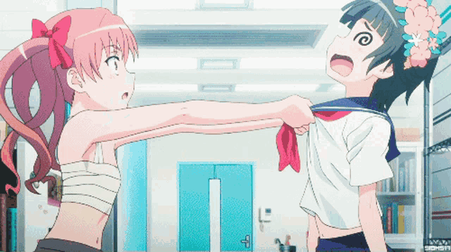 a girl with a bandage on her chest is fighting another girl with a flower in her hair