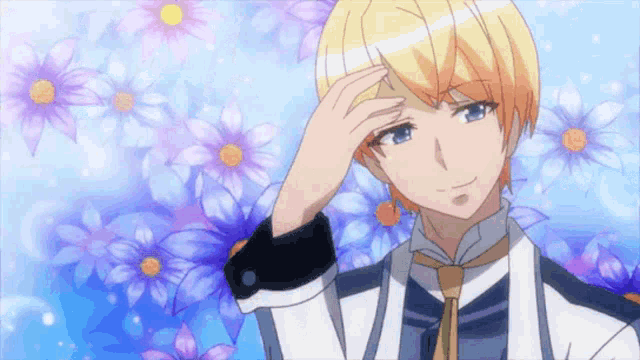 a man with blonde hair is standing in front of purple and blue flowers