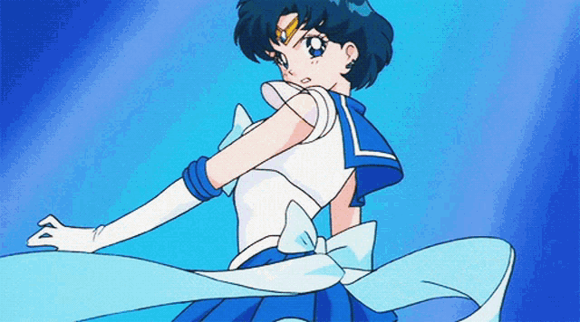 a blue and white cartoon character with a bow on her back