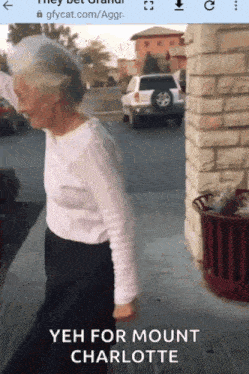 an older woman is walking down a sidewalk with the words yeh for mount charlotte