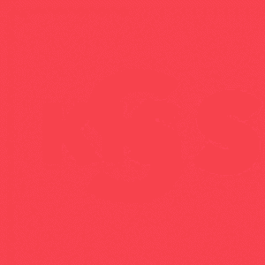 a red letter k on a white background with a blurred background .