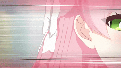 a close up of a girl 's face with pink hair