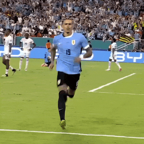 a soccer player with the number 19 on his shirt
