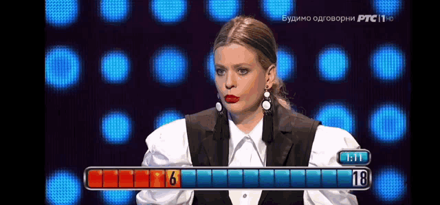 a woman is playing a game with the number 18 on the screen