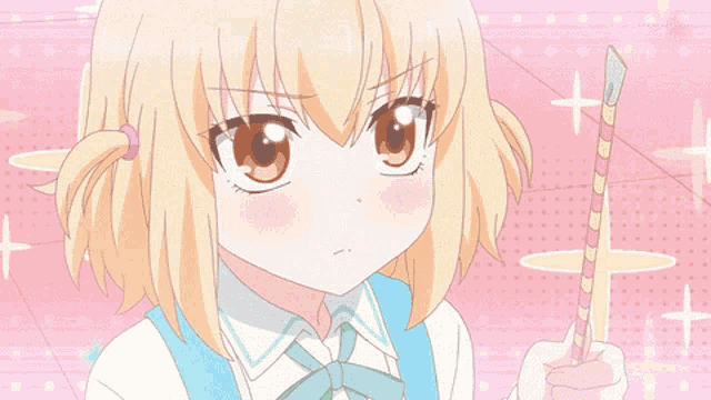 a girl with blonde hair is holding a rainbow stick