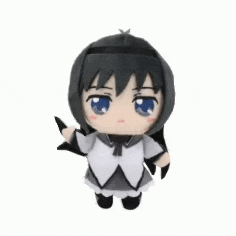 a stuffed animal of a girl with black hair and blue eyes is dancing .