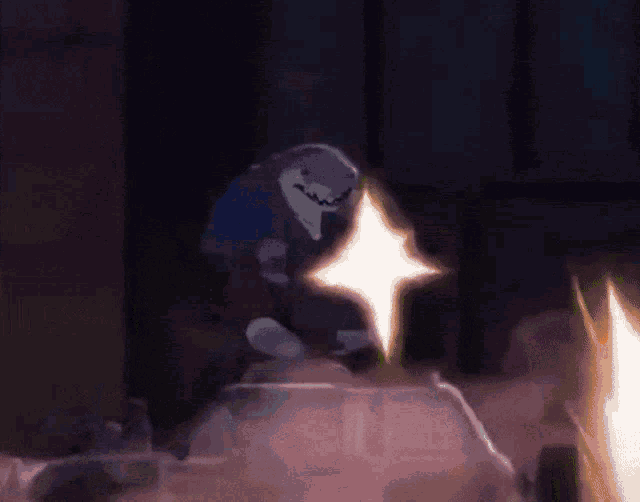 a shark is standing next to a glowing star in a dark room