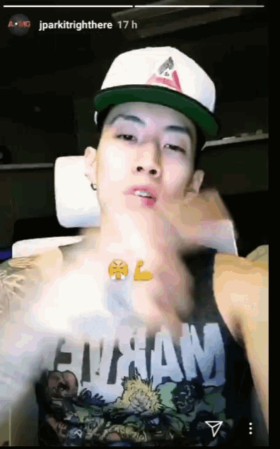 a man wearing a hat and a tank top that says eutan