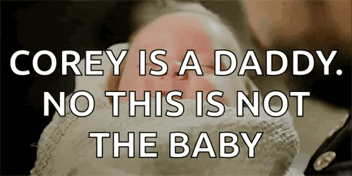 a baby is being held by a man with the words corey is a daddy no this is not the baby