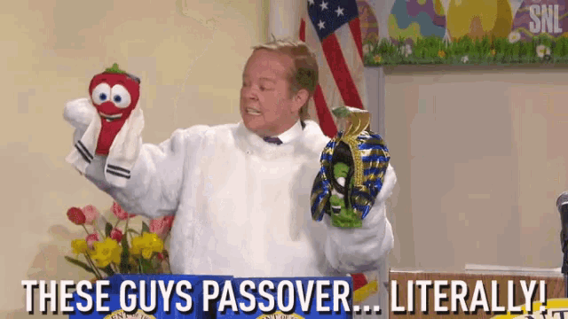 a man is holding a puppet and says " these guys passover ... literally ! "