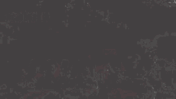 a close up of a red and white object on a grey background .