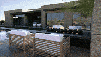 a rendering of a house with two chairs and a fireplace