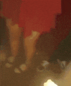 a person is holding a piece of paper in their hand with a light coming out of it .