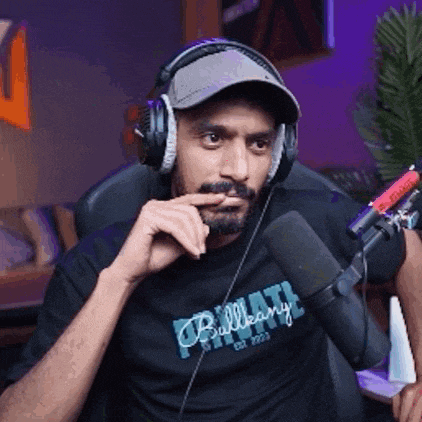 a man wearing headphones and a bullhead t-shirt