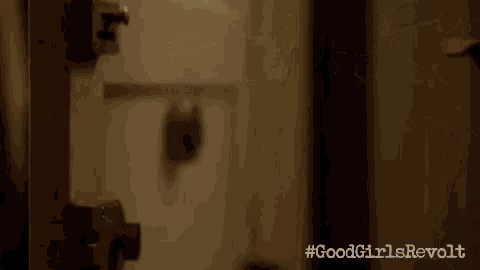 a close up of a person 's hand locking a door .