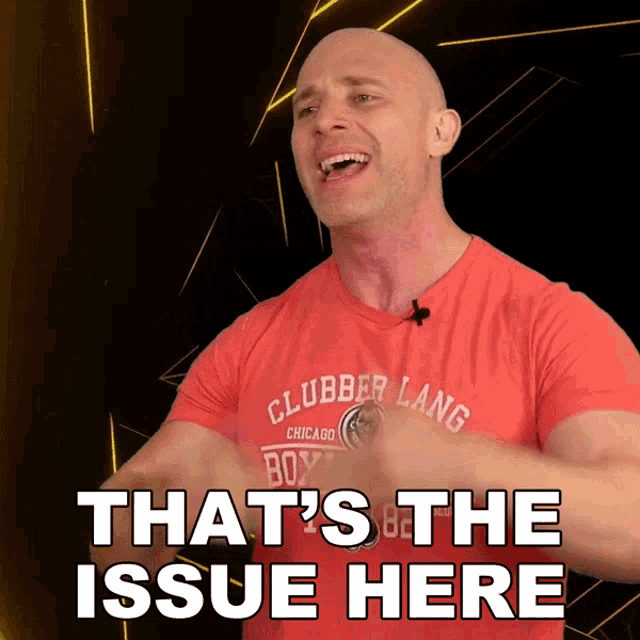 a bald man wearing a red shirt that says clubber lang chicago boxing
