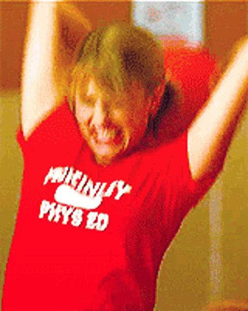 a person wearing a red shirt that says ministry physics ed