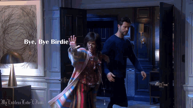 a man and a woman in a room with the words bye bye birdie on the bottom