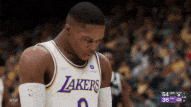 a basketball player for the lakers looks down