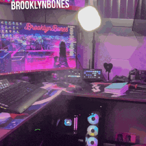 a brooklynbones sign hangs over a computer desk