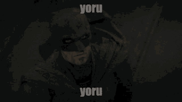 a picture of a man in a batman costume with the words " yoru yoru " on the bottom