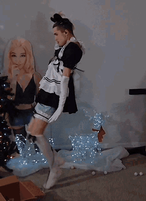 a woman in a maid costume is jumping in the air