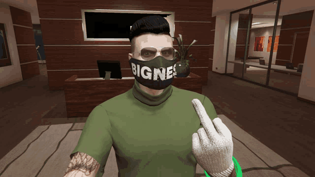a man wearing a mask that says " bigne " giving the middle finger