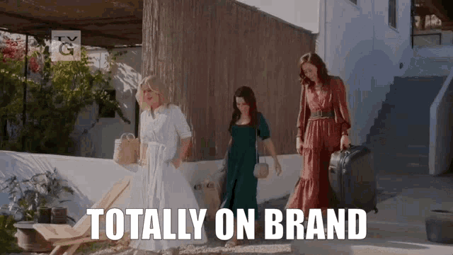 three women are walking down a street with the words totally on brand above them