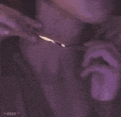 a close up of a person wearing a bracelet on their neck .