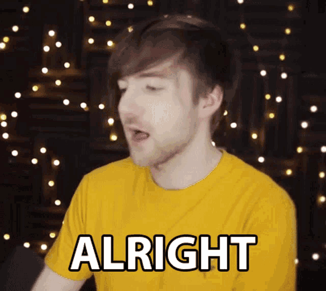 a man in a yellow shirt is making a face and saying alright