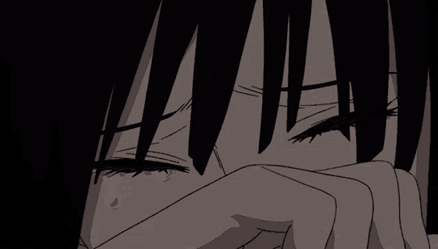 a close up of a person 's face with tears coming out of their eyes
