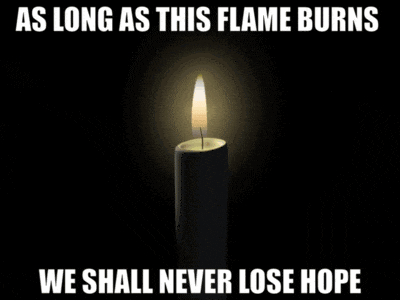 a candle is lit up with the words " as long as this flame burns we shall never lose hope "