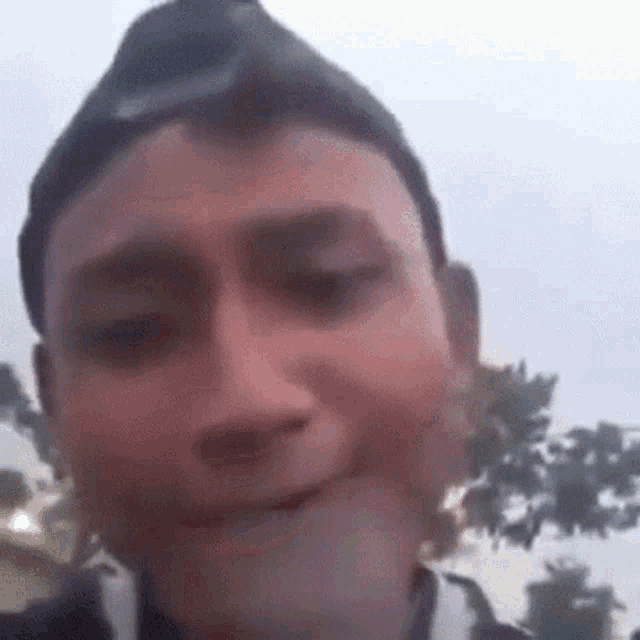 a close up of a man 's face making a funny face .
