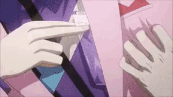 a person pointing at something with their finger while another person holds something in their hand